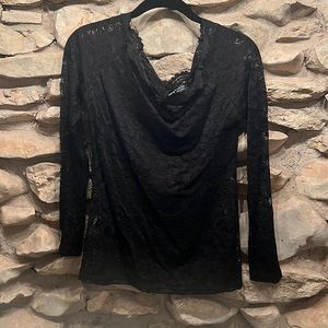 Long sleeved, sheer top. Bandeau across the chest but otherwise sheer